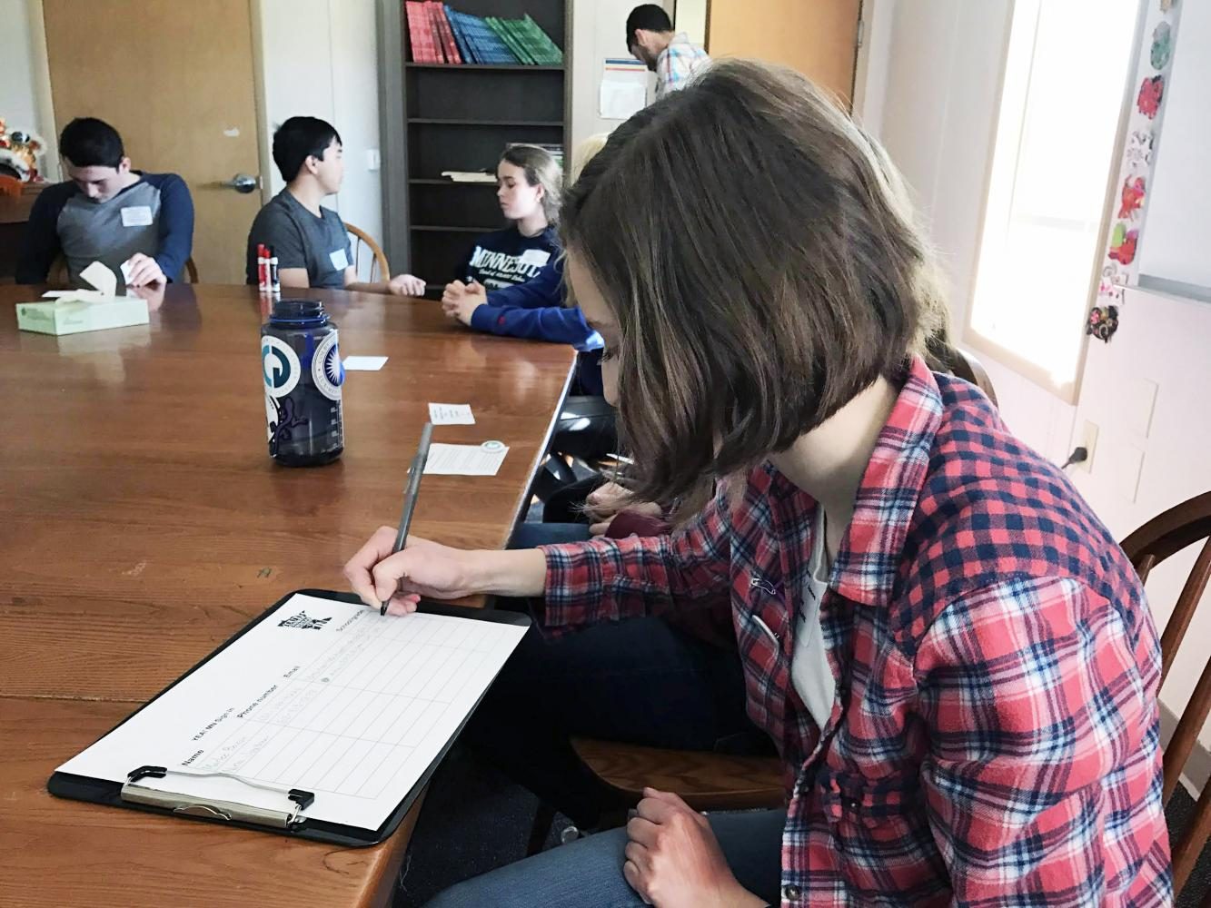 Freshman Nina Smetana signed up for YEA! MN during her session from Meghan Van Loh and Jason Rodney from Climate Generation.