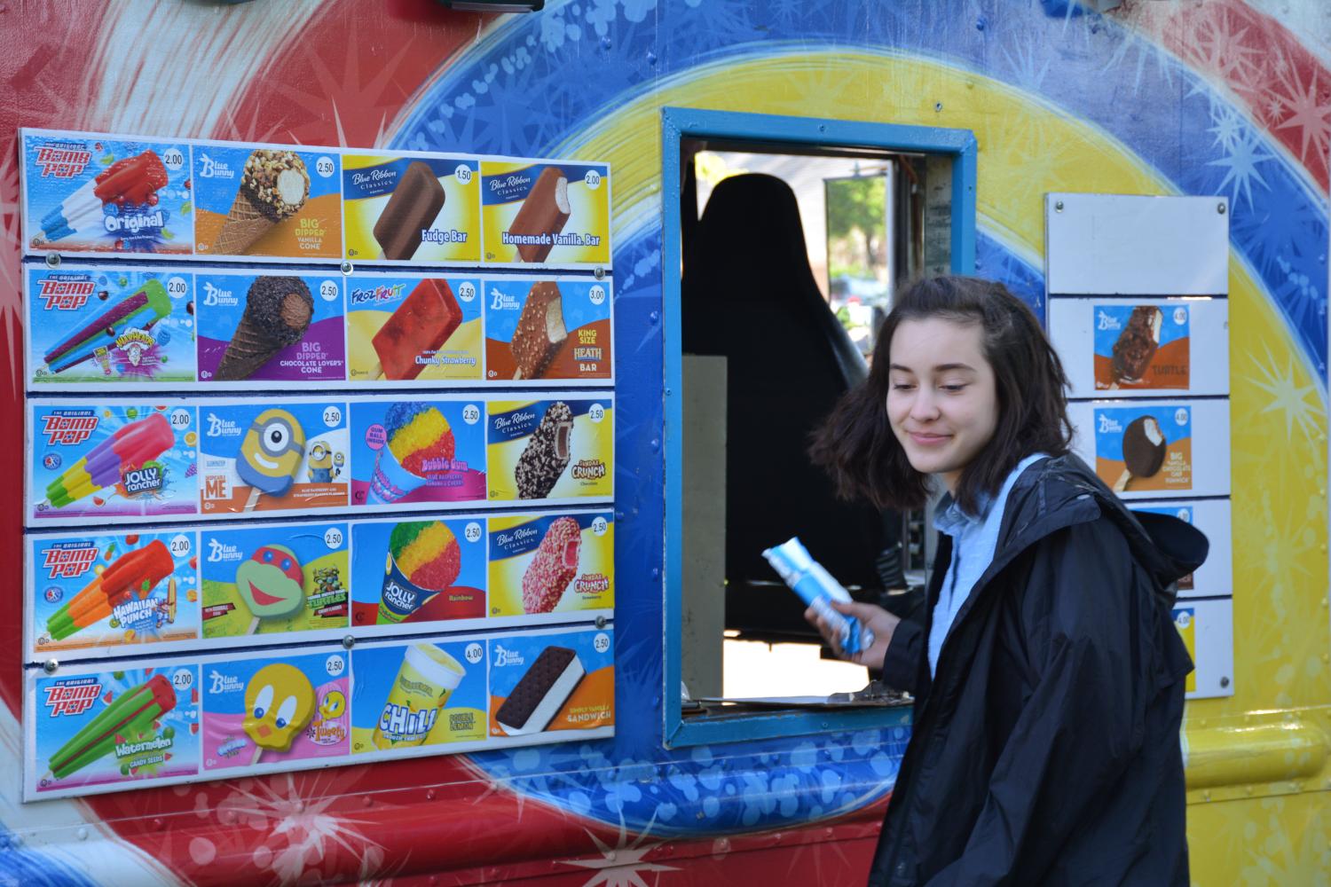 Sophomore Nora Povejsil gets her popsicle from the celebration.