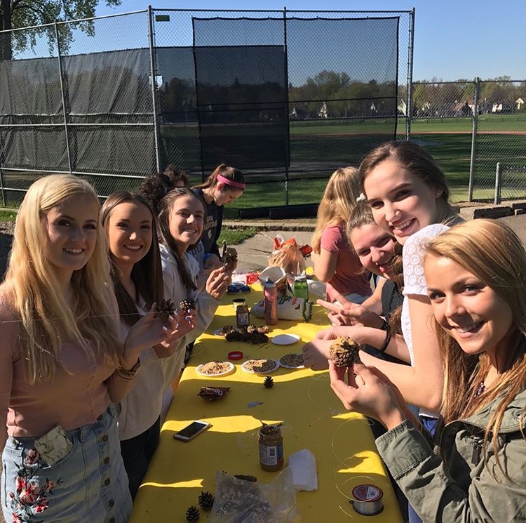 Members of CAS gather outside to make bird feeders. We wanted to do more things that we could physically do...during the club, and we thought making bird feeders would be engaging,” junior co-president of CAS Sophia Rose said.