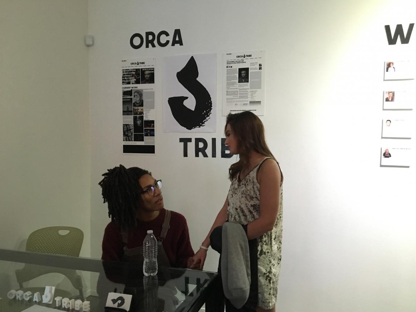Senior co-founder Lutalo Jones talks with senior Leah Hughes at the launch party. “I am excited to see things that students put together. It’s impressive,” Hughes said.