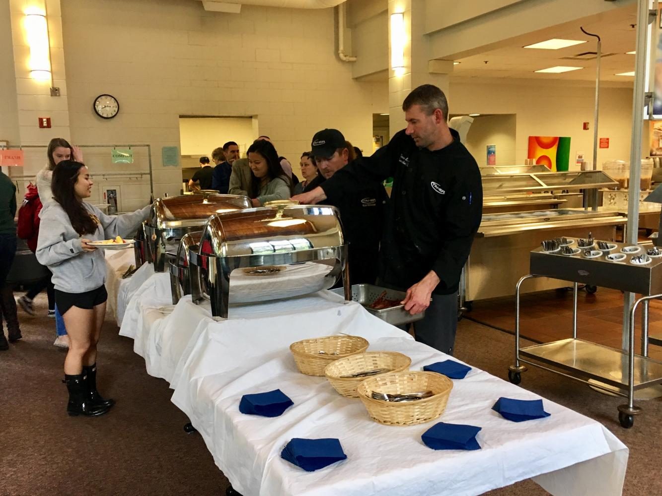 Head Chef Simon Barrow checks the buffet to make sure everything is in order as seniors go through the line.