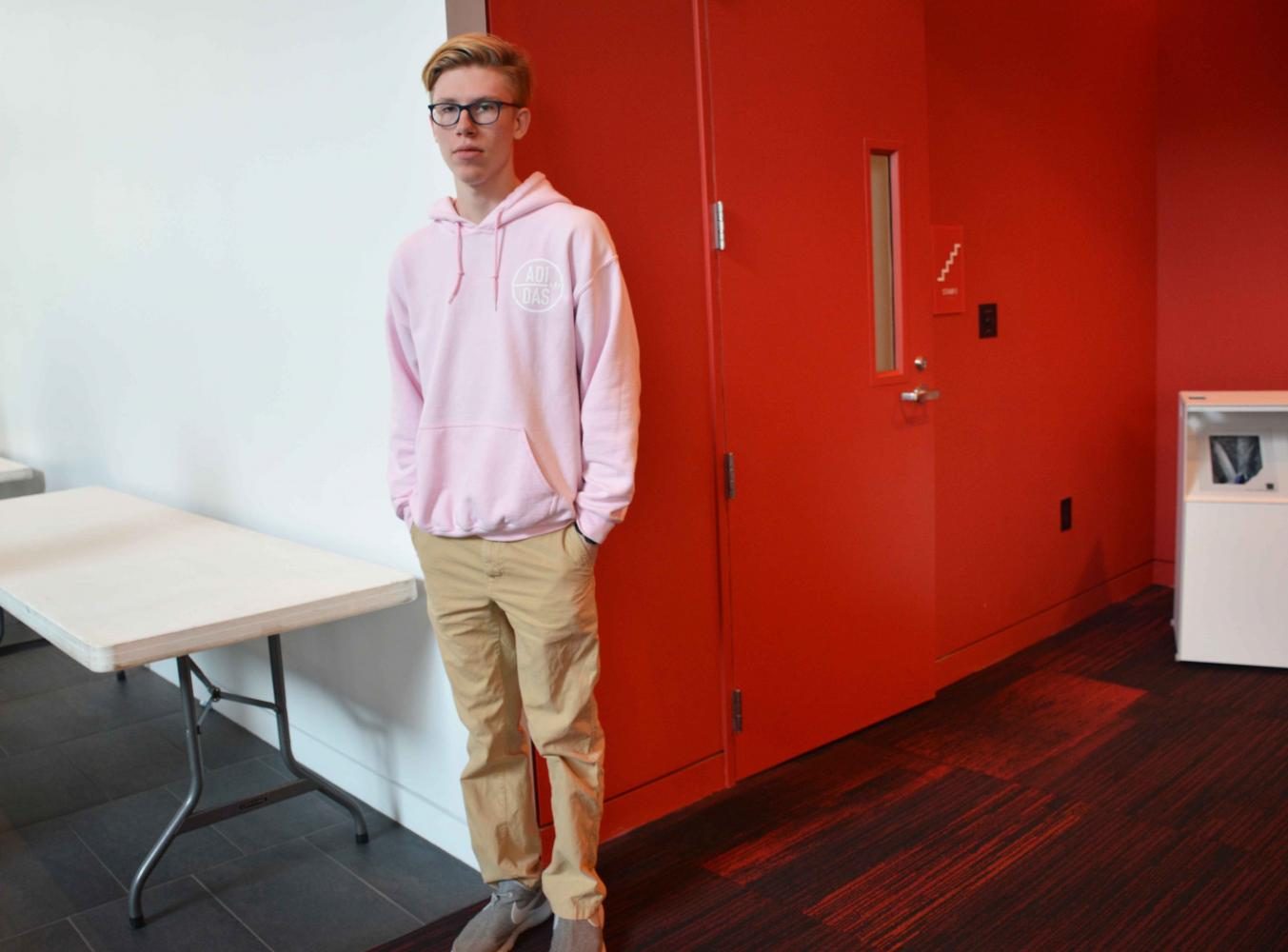 Sophomore Will Swanson matches an all pink Adidas sweatshirt with khakis.