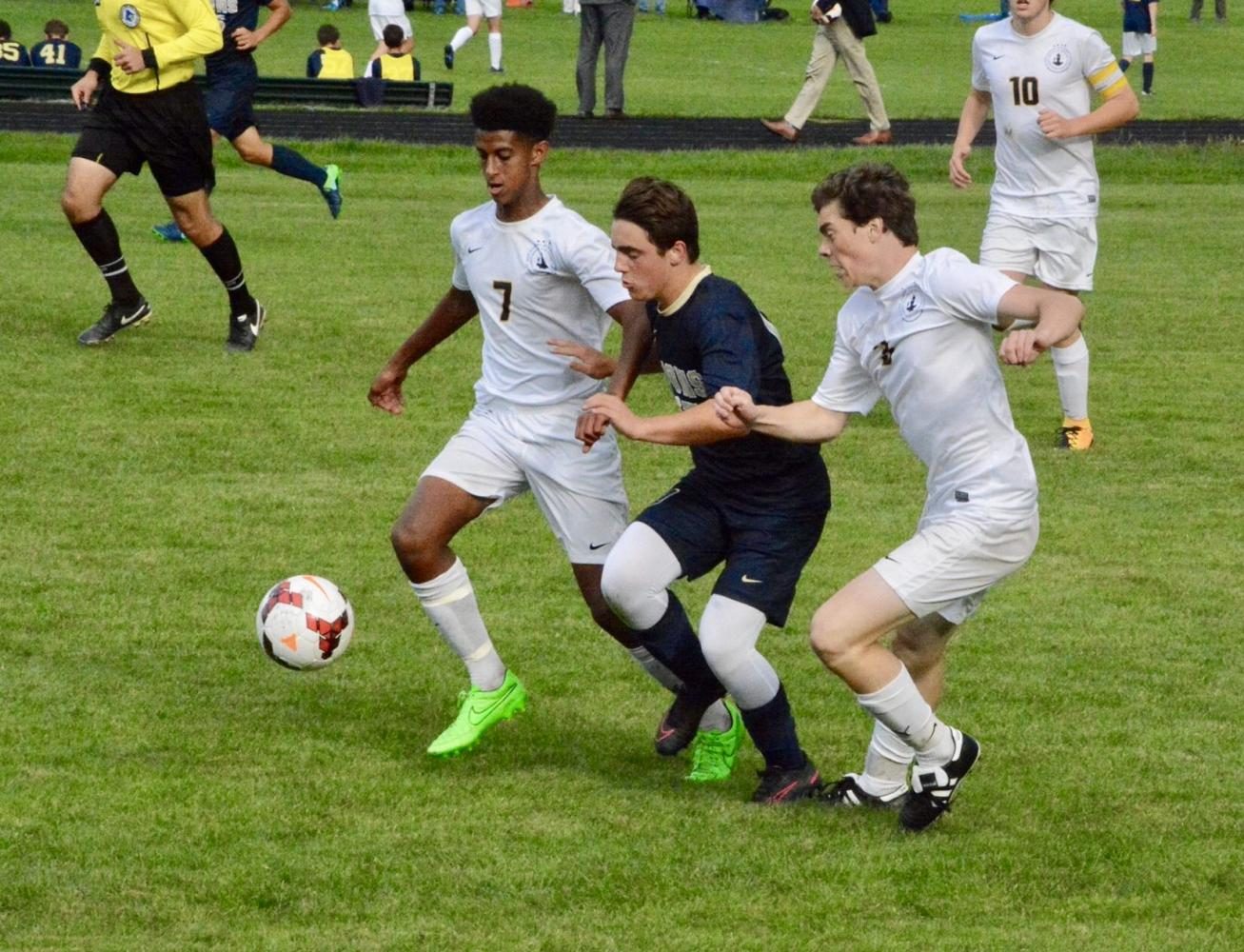 Senior Noah Solomon and junior Jasper Green defend against a Providence player.