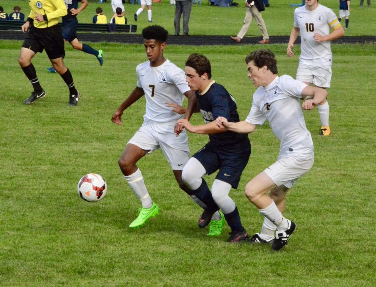 Senior Noah Solomon and junior Jasper Green defend against a Providence player. 