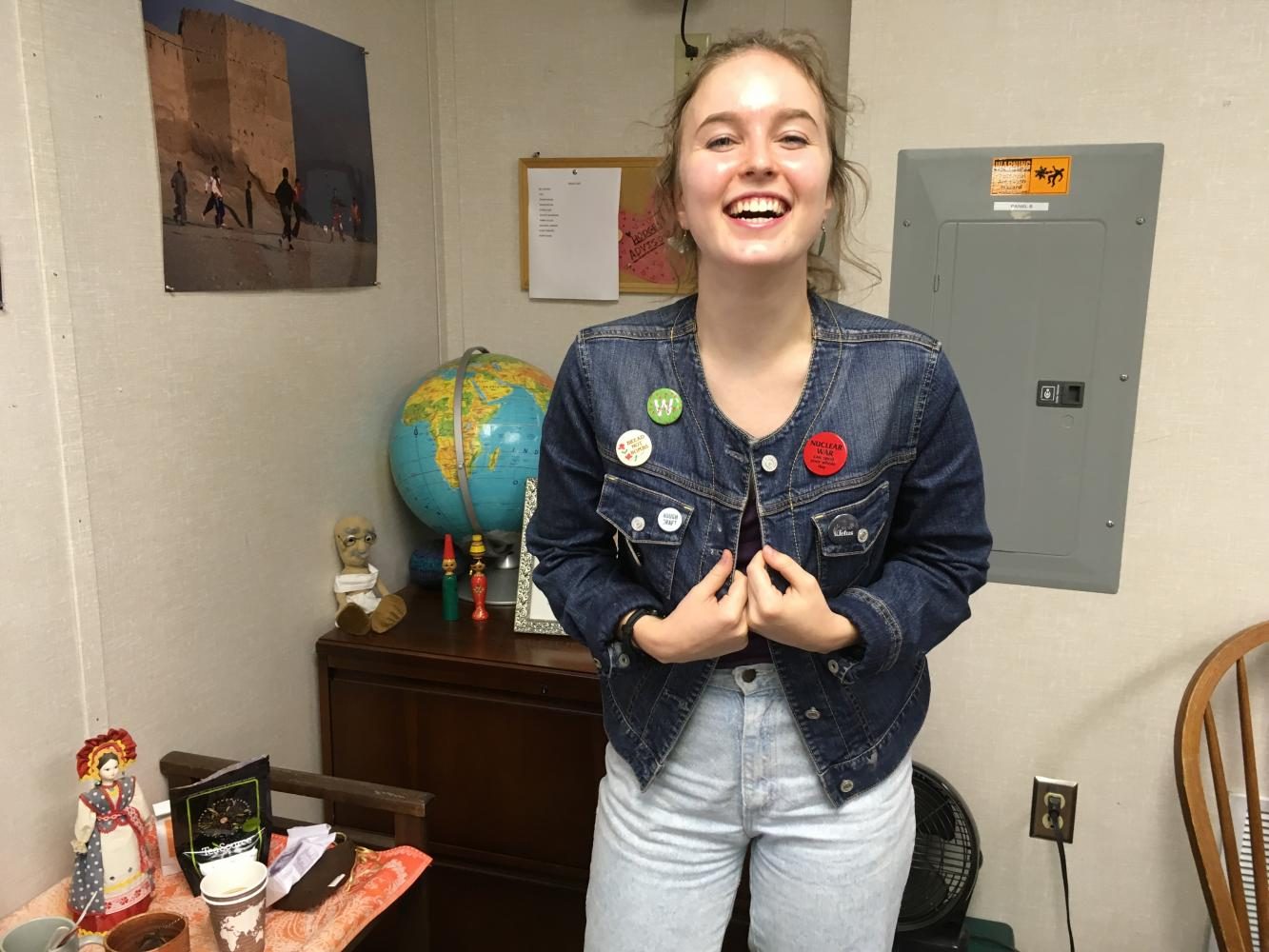 Junior Elise Parsons decorates her jean jacket with various buttons.