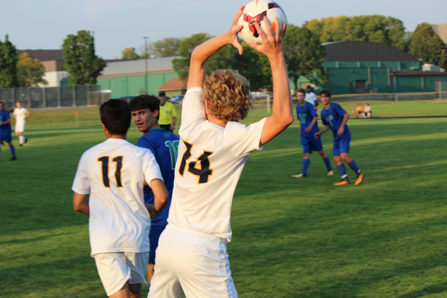 Junior Ben Carlsson prepares to throw in the ball.