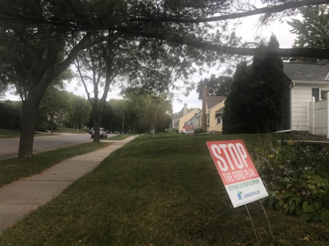 A sign against the Ford Plan.