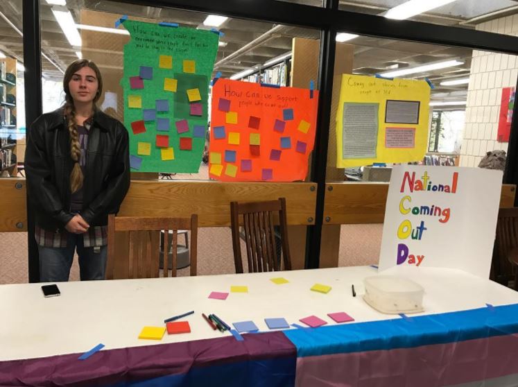 11th grader Zoe Hermer-Cisek runs the Coming Out Stand