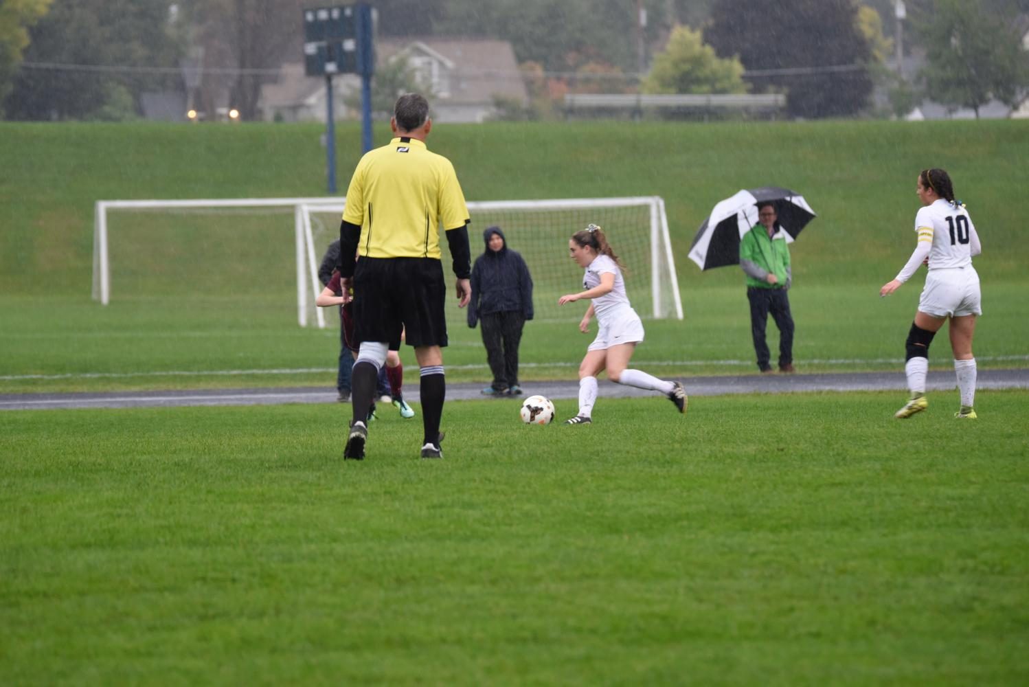 Junior Tessah Green pushes the ball out of her defensive third to start an attack.