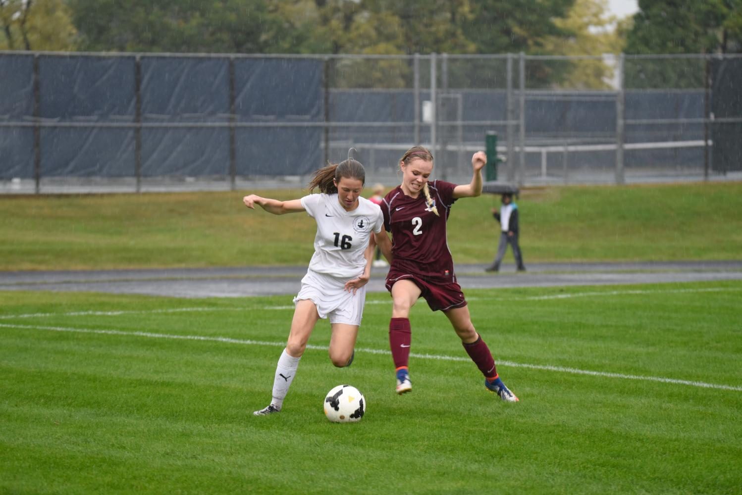 Sophomore Ayla Straub attempts to dribble down the sideline to create a chance.