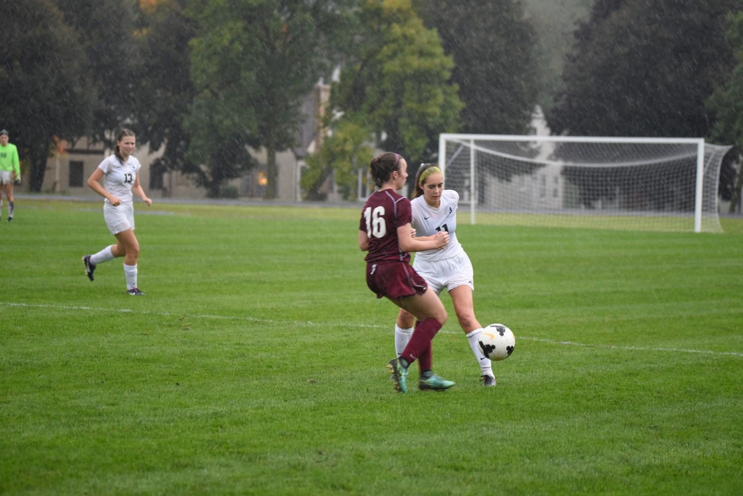 Senior Hannah Scott fights to gain possession of the ball.