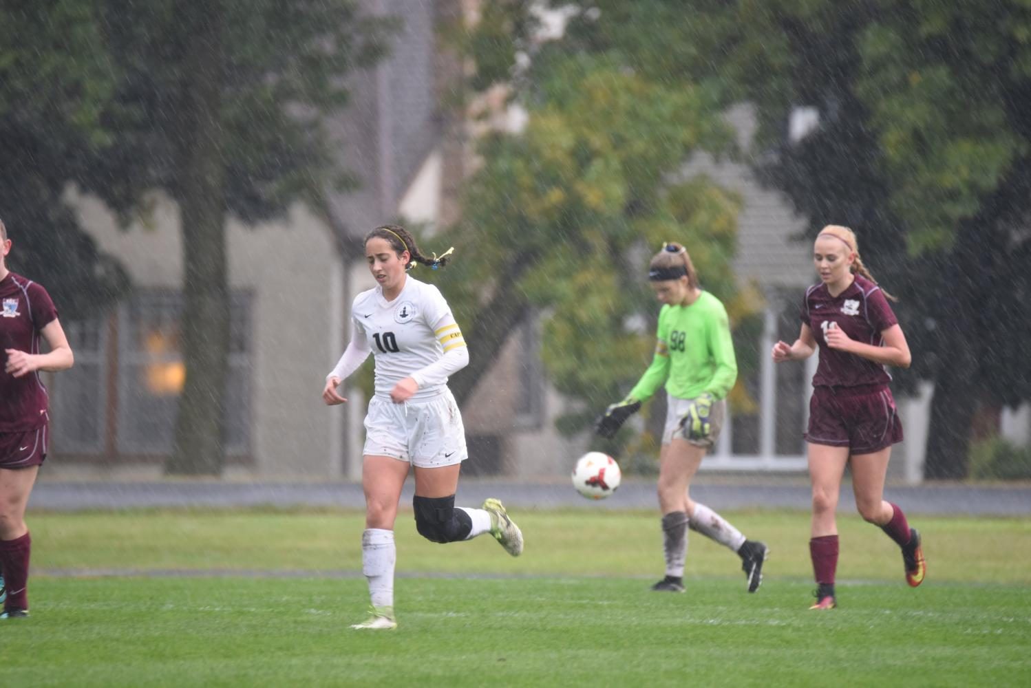 Seniors Belle Smith and Dina Moradian push players up the field.