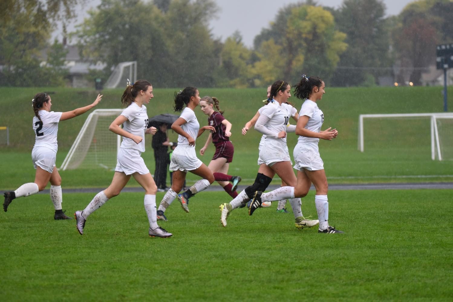 The Spartans celebrate a goal.