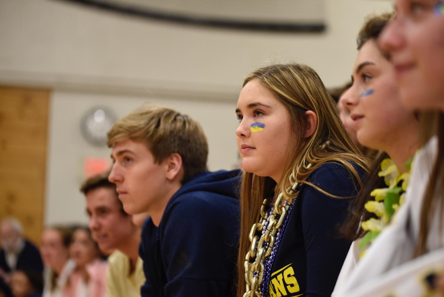 Juniors Andrew Johnson and Kenzie Giese watch Pep Fest activities. 