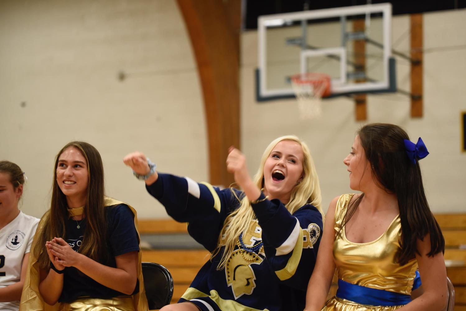 Seniors Emilia Hoppe, Ashley Jallen and Val Hart prepare to race for the captain challenges. Pep Fest is fun every year, but I really tried to embrace every moment of it this year as it was my last, Jallen said.