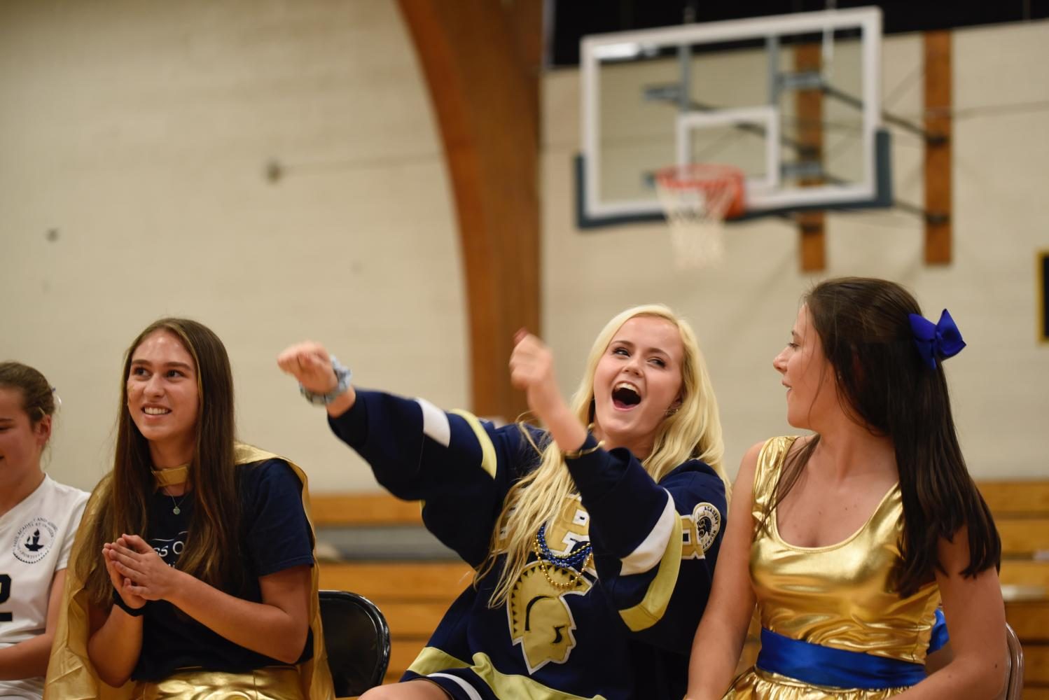 Seniors Emilia Hoppe, Ashley Jallen and Val Hart prepare to race for the captain challenges. "Pep Fest is fun every year, but I really tried to embrace every moment of it this year as it was my last," Jallen said.