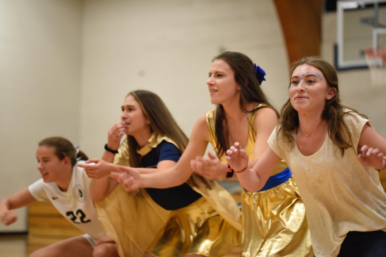 Seniors and captain of GVS Kelly Fiedler, Boys Cross Country representative Emilia Hoppe, Girls Cross Country captain Val Hart and Girls Tennis captain Isabel Brandtjen run to find the item they need for the captain challenges. 