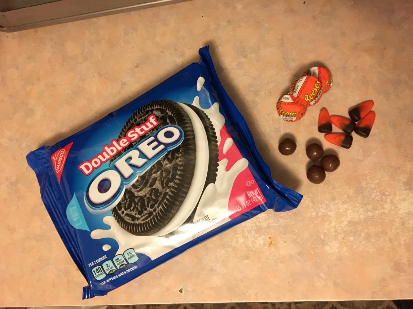 Make use of leftover candy corn, Whoppers, and Reese's Peanut Butter Cups. Note: Milk duds or Rolos can be substituted in for Whoppers. 