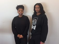 Seniors Olivia Williams-Ridge and Amina Smaller present their black outfits. I’m wearing black because the American flag does not represent anything but oppression to me, Smaller said. 