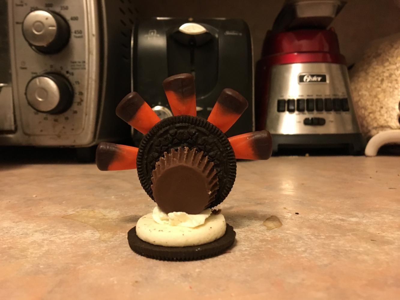 Step 4. Poke candy corn into the creme-filling of the Oreo in a fan shape. 