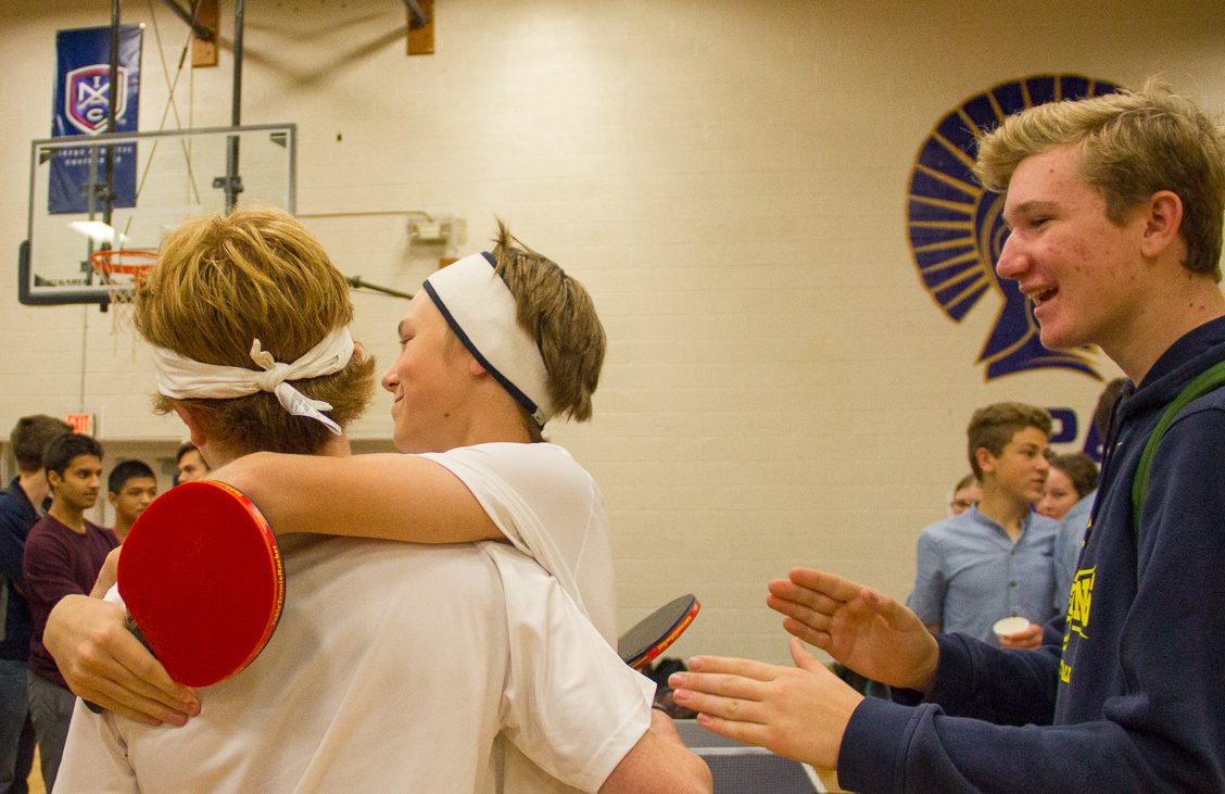 Students celebrate winning their match.