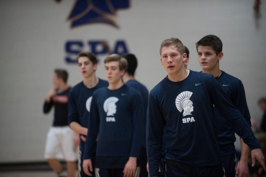 SHOUT OUT. To get through a long season, the boys basketball team bonds on and off the court. “Just spending so much time with my best friends is what makes the season so much fun,” captain Gus Grunau said.