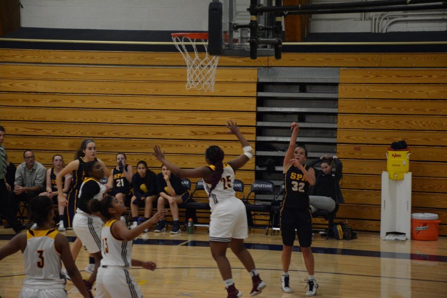 Senoir Kelly Fiedler shoots at the hoop.