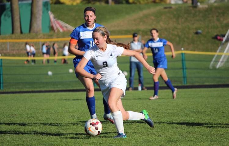 Hoffman carries the ball with poise to slice through the Trinity defense. 