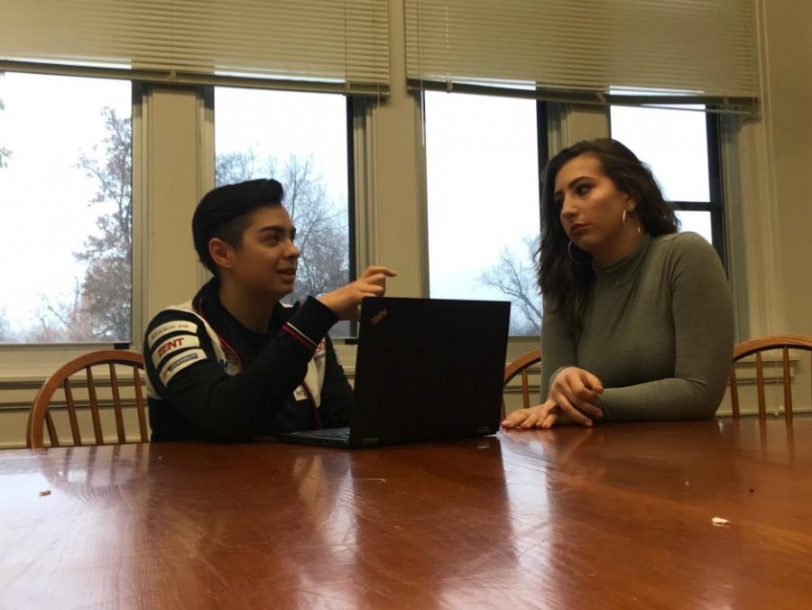 Seniors Aaron Datta and Sylvie Schifsky work together on an upcoming English presentation about using feminist and queer theory to analyze text. “I can try to teach others about the gender-queer experience, but it also means that I have to understand that all of my actions re ect a bunch of other people now,” Datta said.