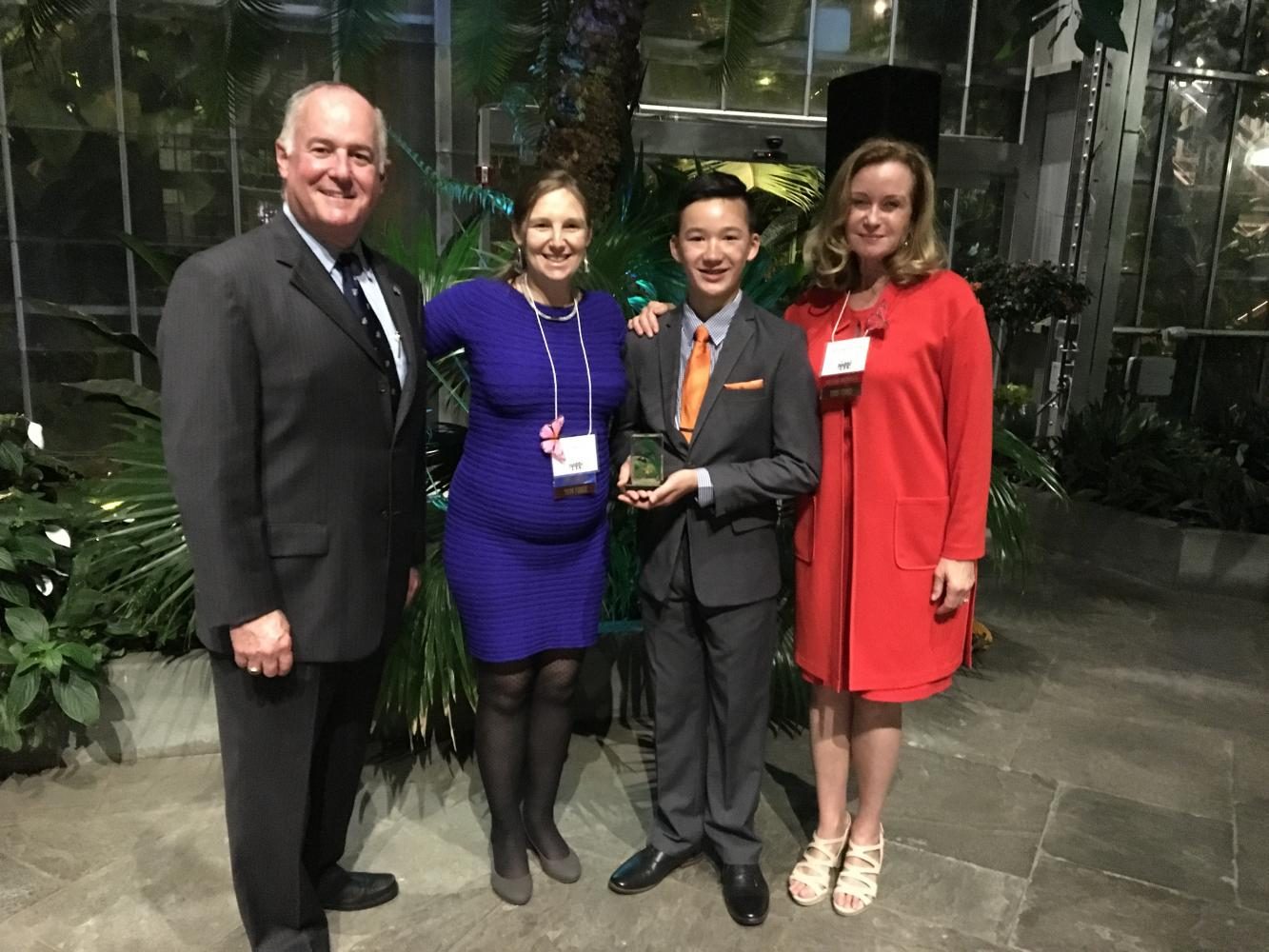 At the 2017 NAPPC Pollinator Advocate Award, Nikolas Liepins stands next to staff members presenting his award.   “...This year, reportedly, had the most nominees in the history of the award... I am extremely grateful and honored,” Liepins said. 