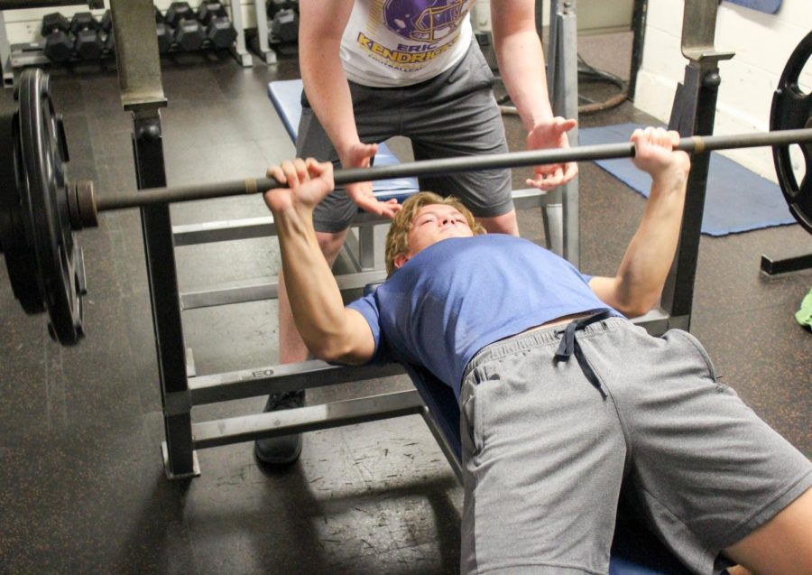 Junior Adam Zukowski lifts in the weight room.