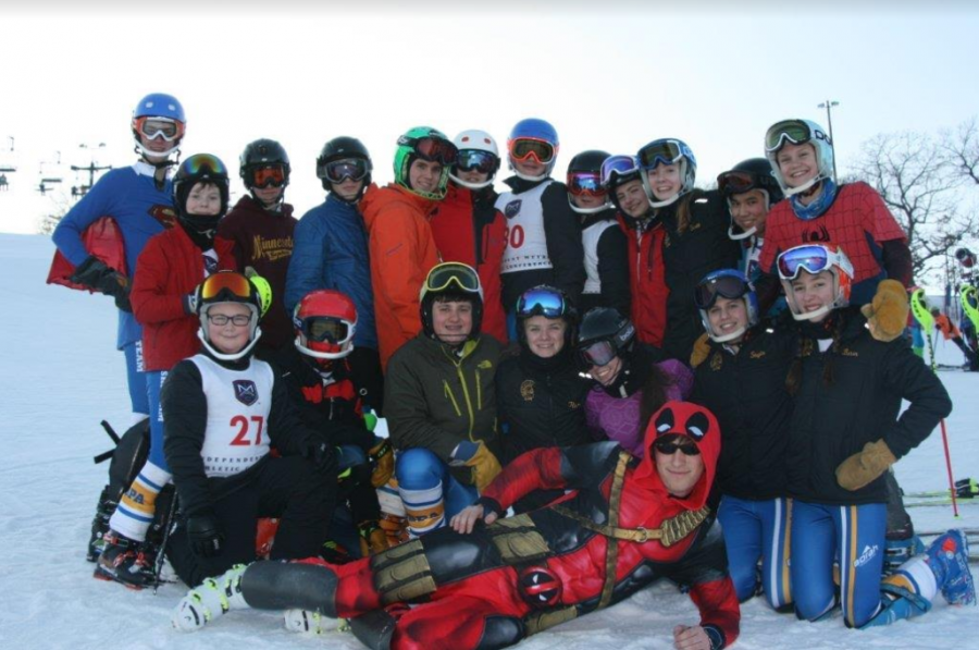 CAPTAINS OF COLD. The Alpine Skiing team poses for a group picture during the 2016-17 season: "It's pretty much just hanging out with your friends for four hours after school. Who wouldn't have fun with that?" sophomore Fremont Forsberg said. 