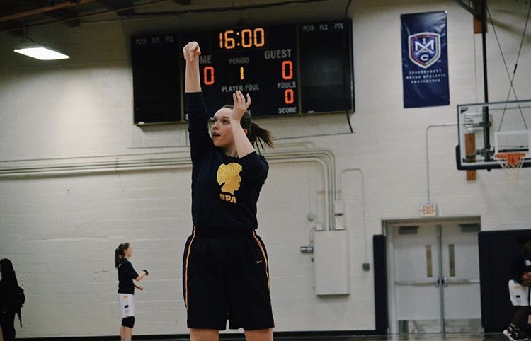 WE’RE ALL IN THIS TOGETHER. After warm ups, Girls Varsity Basketball uses tradition to feel unified. “When we are on the court right before the game starts, we get in a huddle and we chant,” sophomore Audrey Egly said.