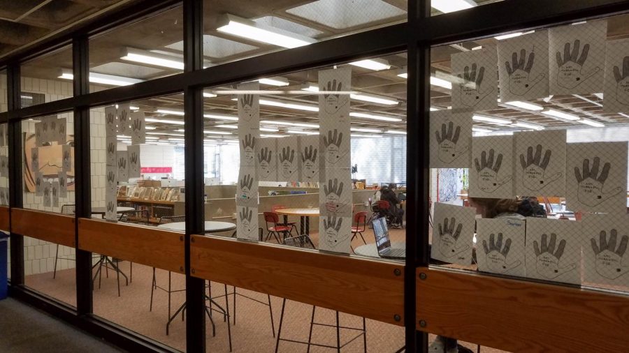Letters of thankfulness that sophomores wrote have been arranged to read SOPHS on the windows of the library.