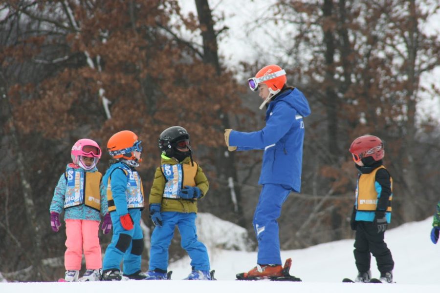 Senior Marlee Baron works with a group of beginning skiers at Afton Alps. She said that lessons are the best part of her job.