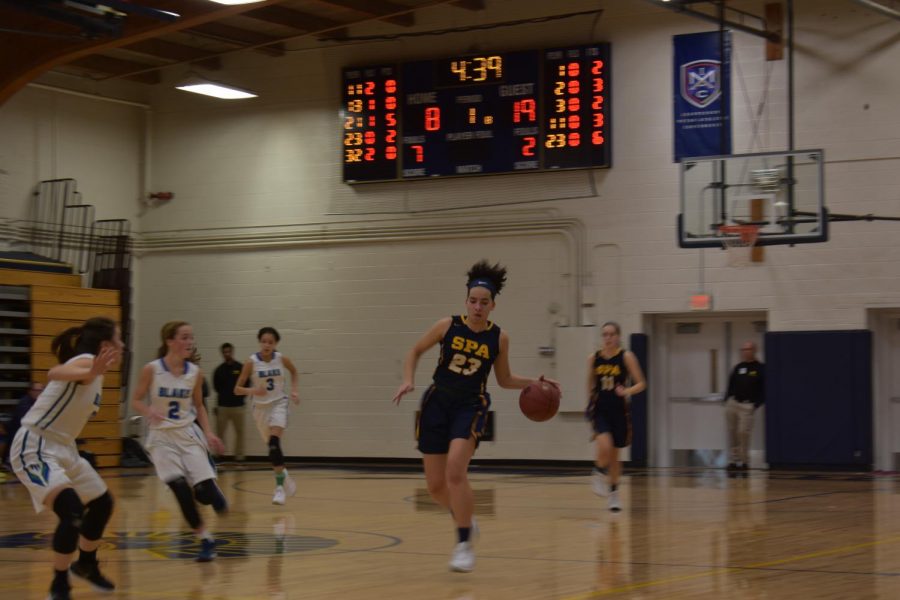 Senior Izzy Denny takes the ball from a Blake player. 