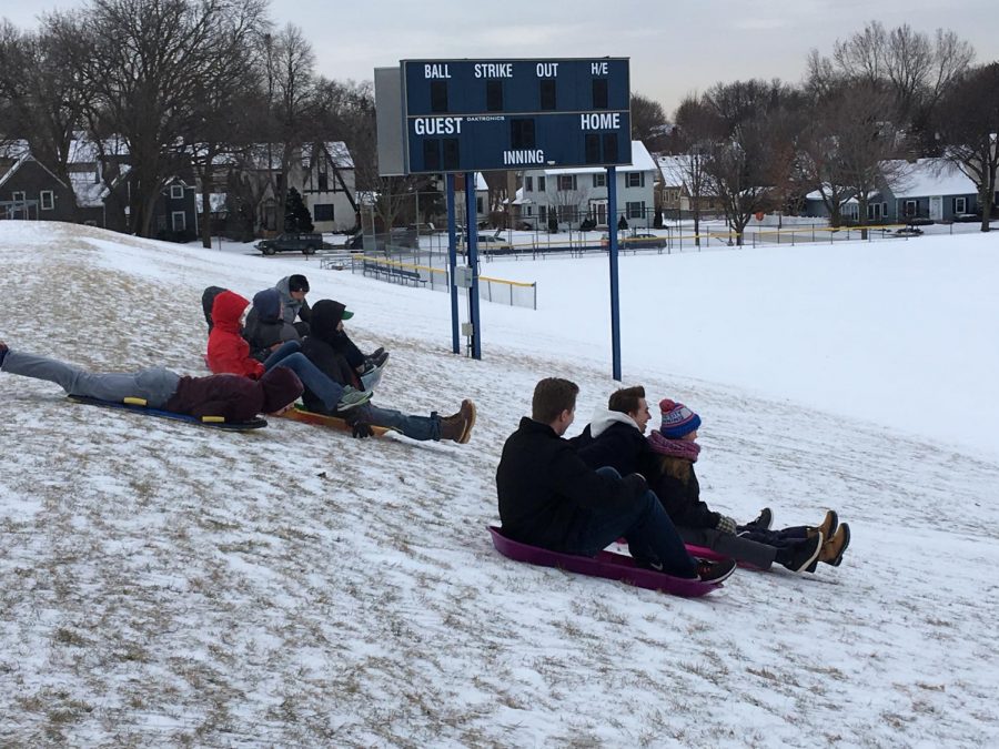 Students gathered at the upper field to sled during X-period on Jan. 4. Outdoors Club hosted the event. Our goal is always just to get people outside and have fun. It was cold, but there was cocoa, co-president Hannah Scott said.