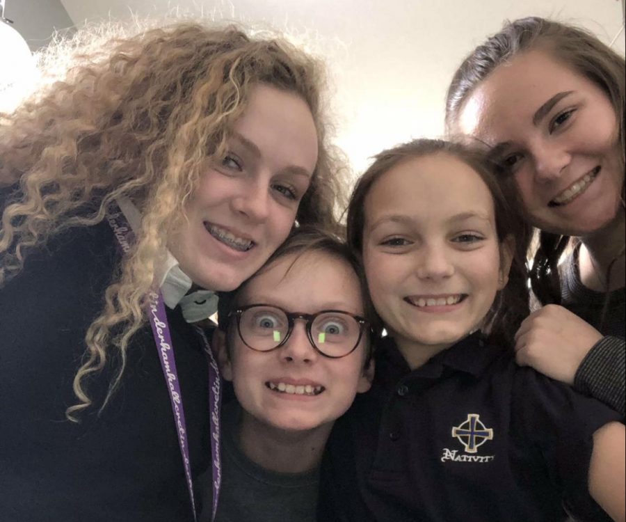 Senior Libby Woodson and the children she nannies goofing off and having a good time. “I would totally recommend it if you like kids because it’s super easy, and kids are cute,” Woodson said.