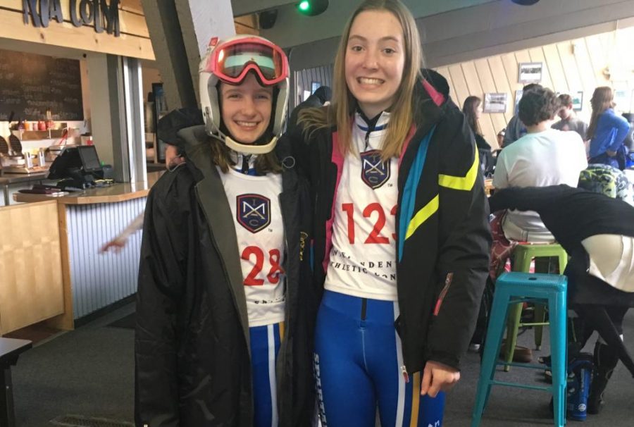 Ladenburger and ninth grader Julia Scott buckle up before they head out to an Alpine race. “I like painting class, which isn’t really an academic class but I think it’s fun. I also do skiing, and I like doing that through the school here,” Ladenburger said.