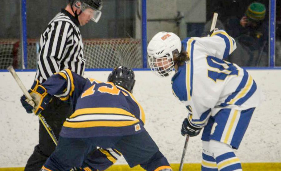 Junior Nolan Gifford faces off for the puck. 