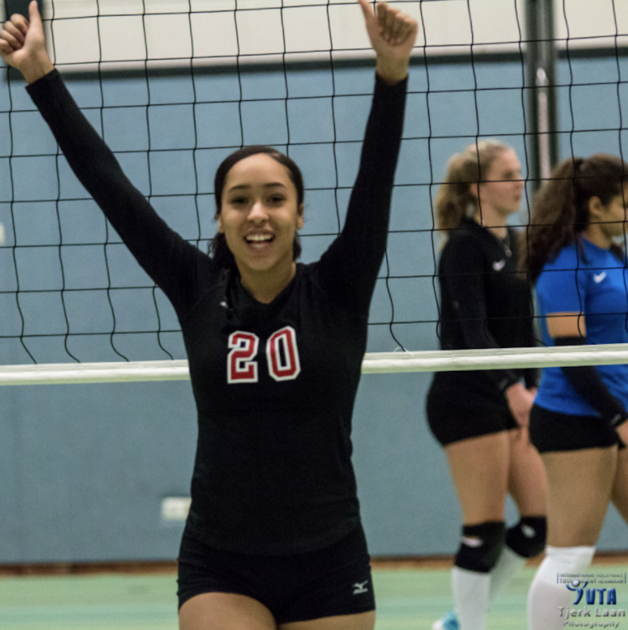 CELEBRATE. Sophomore Arie Walker plays in a volleyball game during a tournament in Europe. It was amazing to see how other people interact, Walker said. 