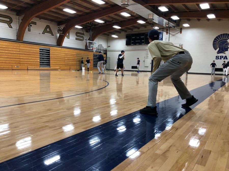 Sophomore Andy Ellis practices his lead off as the Spartans prepare for their season.