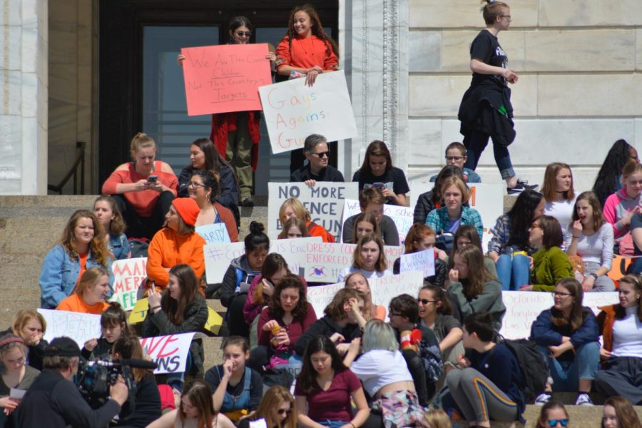 SPA students whon walked our hold their signs at the Capitol and wait for the rally to begin. 