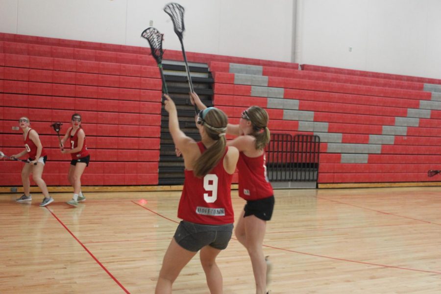 Hayley Hoffman and Erin Magnuson fight for the ball. The team is pretty competitive. United is a growing lacrosse program and we have continued to improve over the years, said Hoffman. 