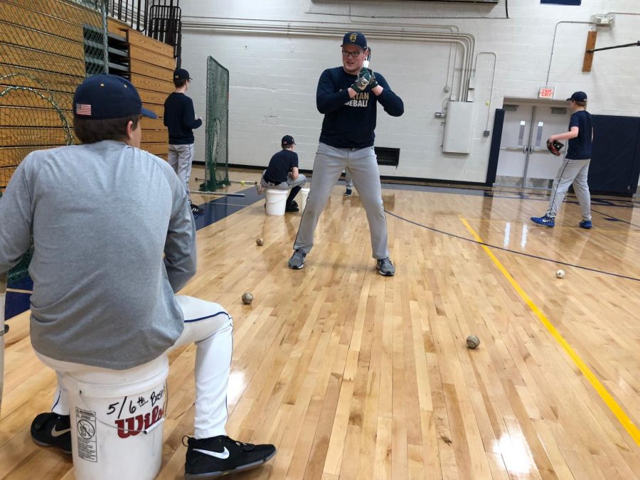 Senior Ryan Moore works on his hitting mechanics during a practice last season.