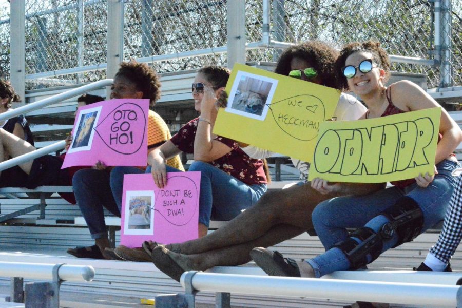 Students support the spring Ultimate Frisbee team on the bleachers beside Lang field.