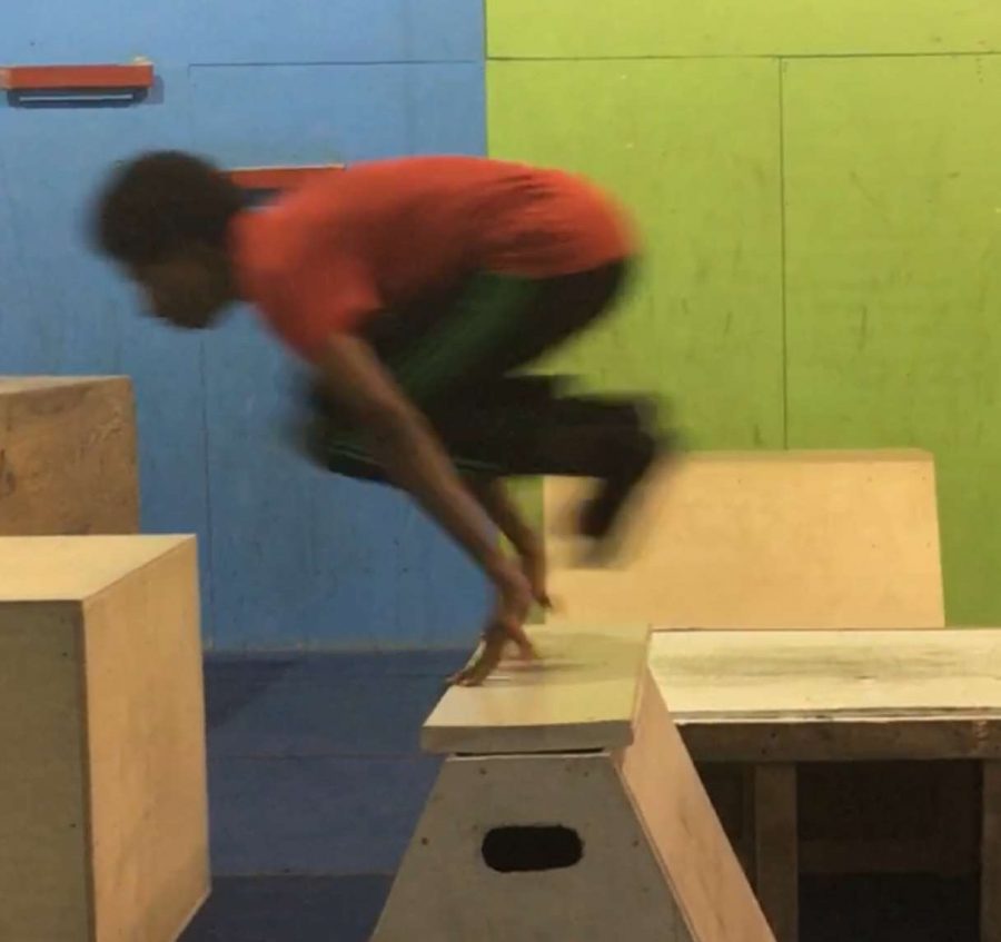 Junior Imran leaps across an obstacle as he freeruns across a parkour course. “Ive been doing parkour for about three years, since freshman year, Umer said.