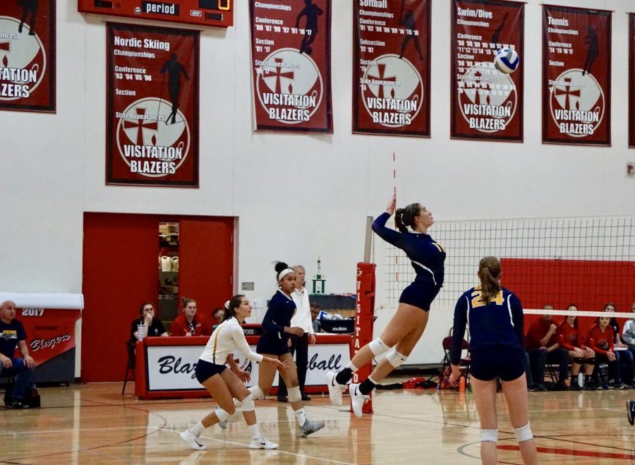 Senior and captain Blythe Rients gets a kill off of a backrow attack in the Girls Varsity Volleyball game against Visitation on Sept. 21. 