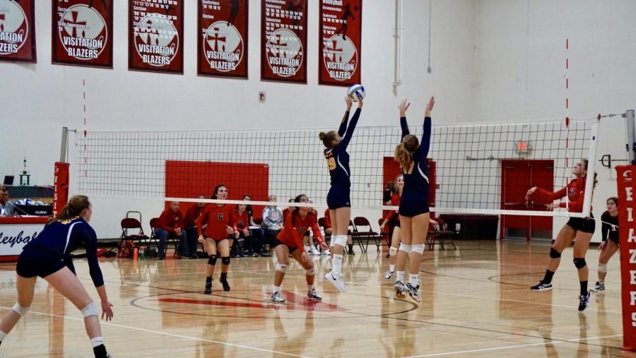 Eight grader Solvej Eversoll gets a block against Visitation. 