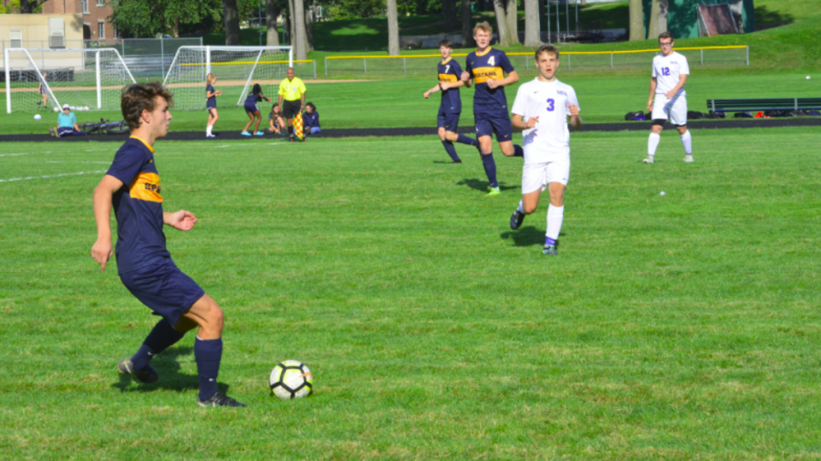 Junior Thomas Bagnoli gains control of the ball in the first half of the game.